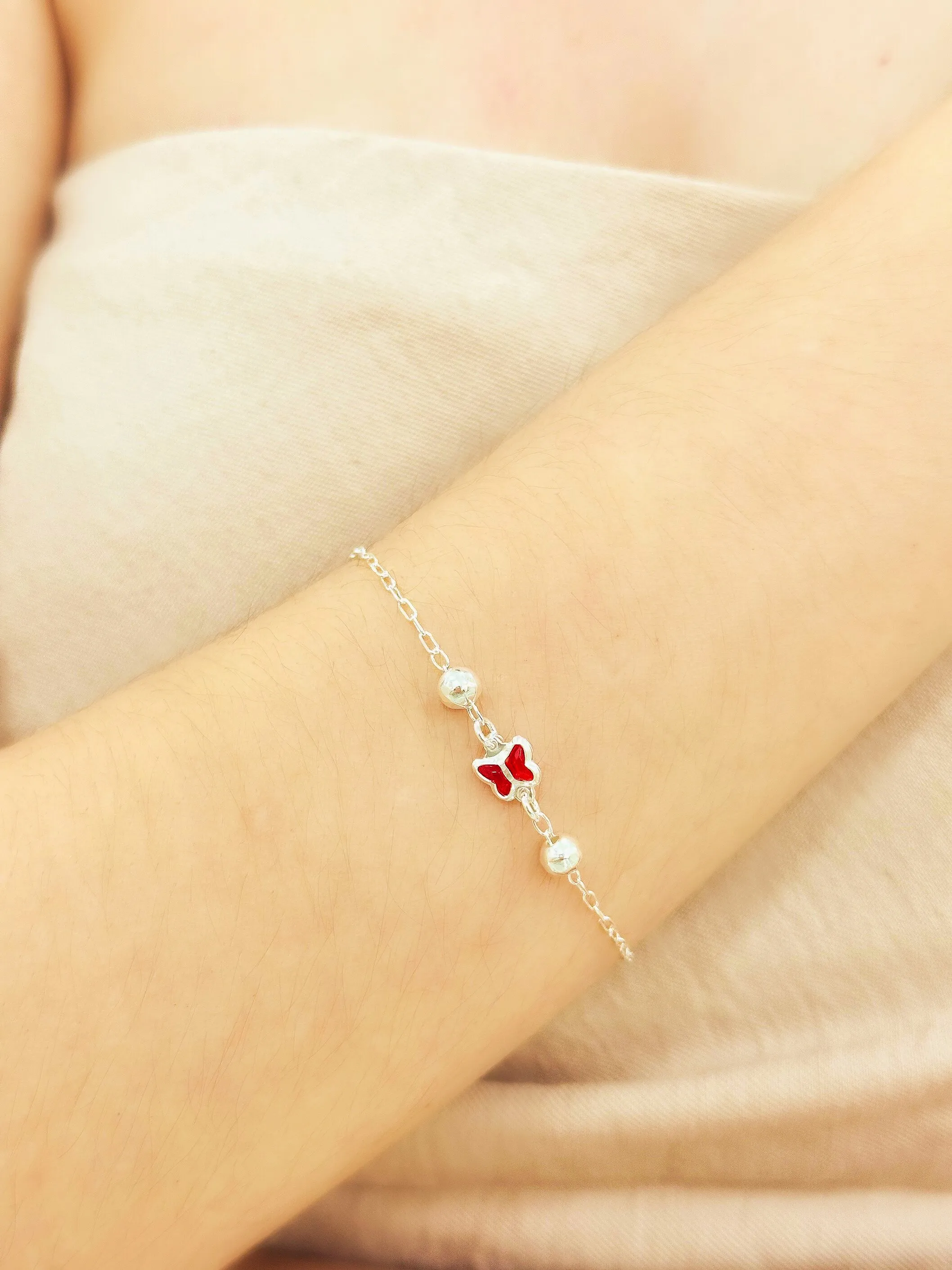 PULSEIRA PRATA BORBOLETA VERMELHA COM BOLAS