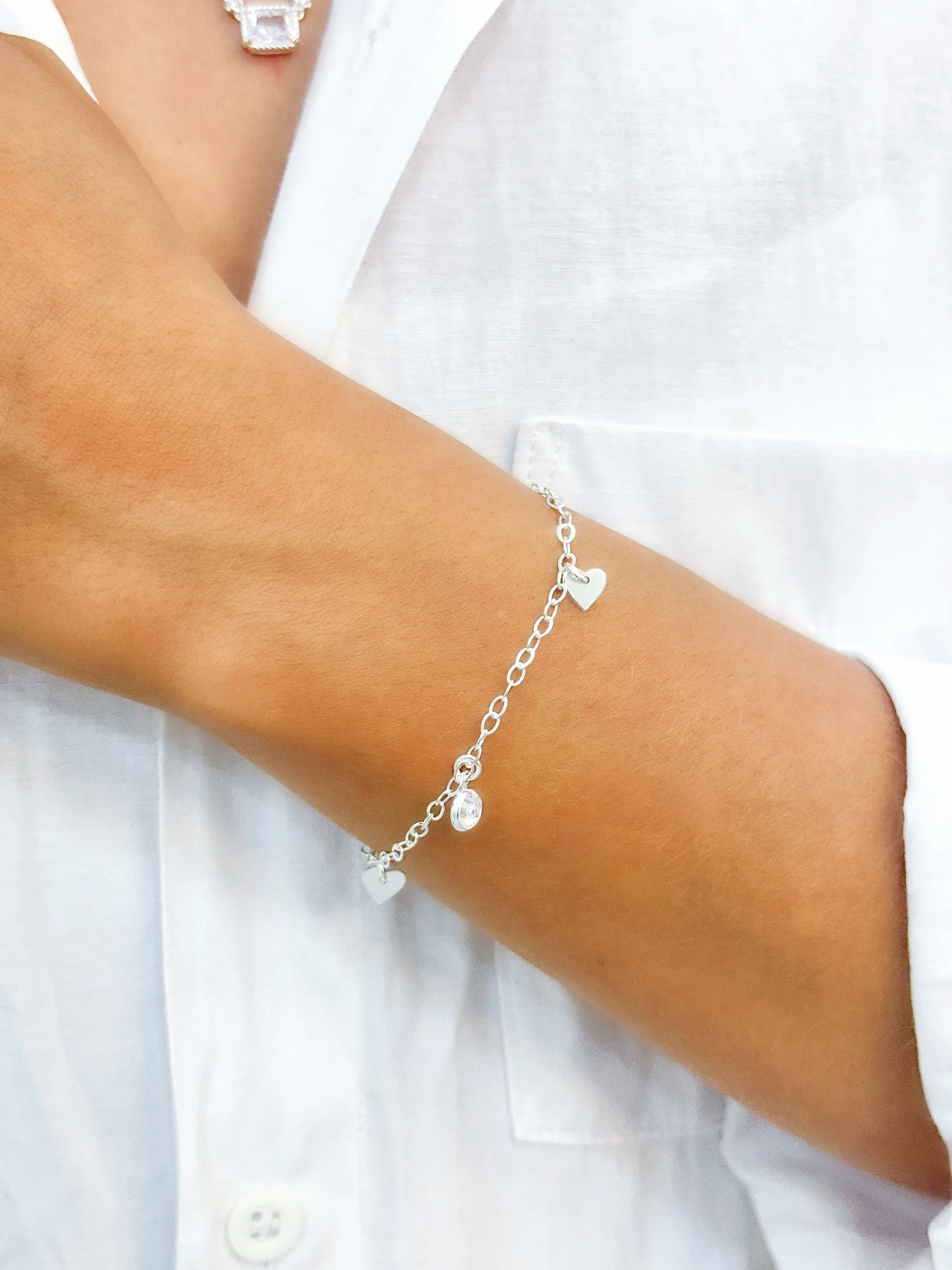 PULSEIRA PRATA PONTO DE LUZ E CORAÇÕES
